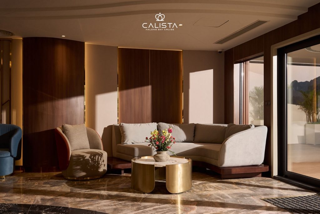 Luxurious cruise lounge with panoramic bay views and elegant seating.
