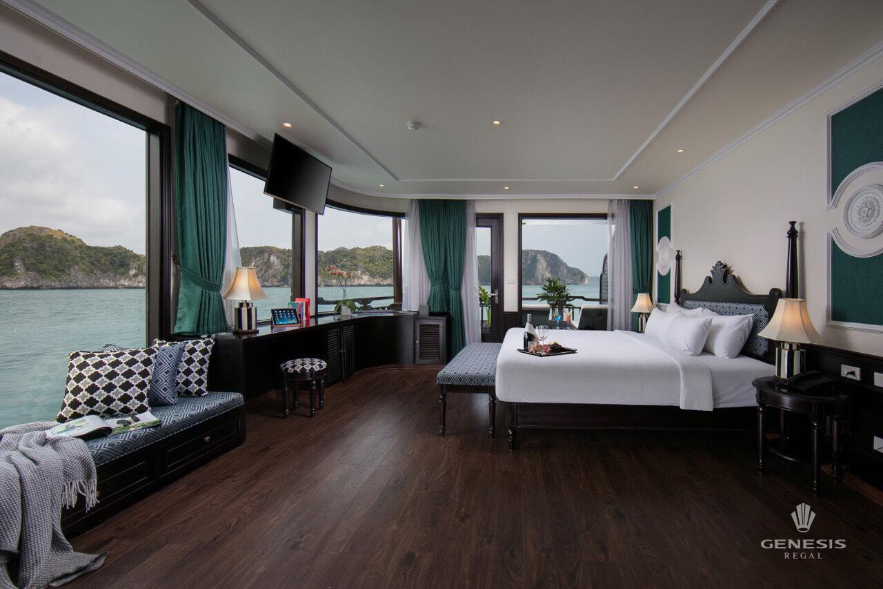 Luxurious cruise cabin with stunning Halong Bay views and elegant decor.