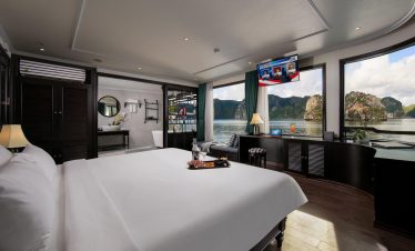 Elegant cruise balcony overlooking Halong Bay's stunning limestone karsts, perfect for a romantic ge.