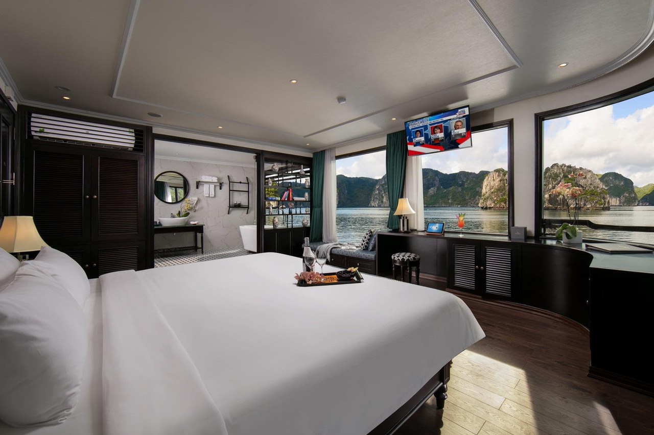 Elegant cruise balcony overlooking Halong Bay's stunning limestone karsts, perfect for a romantic ge.