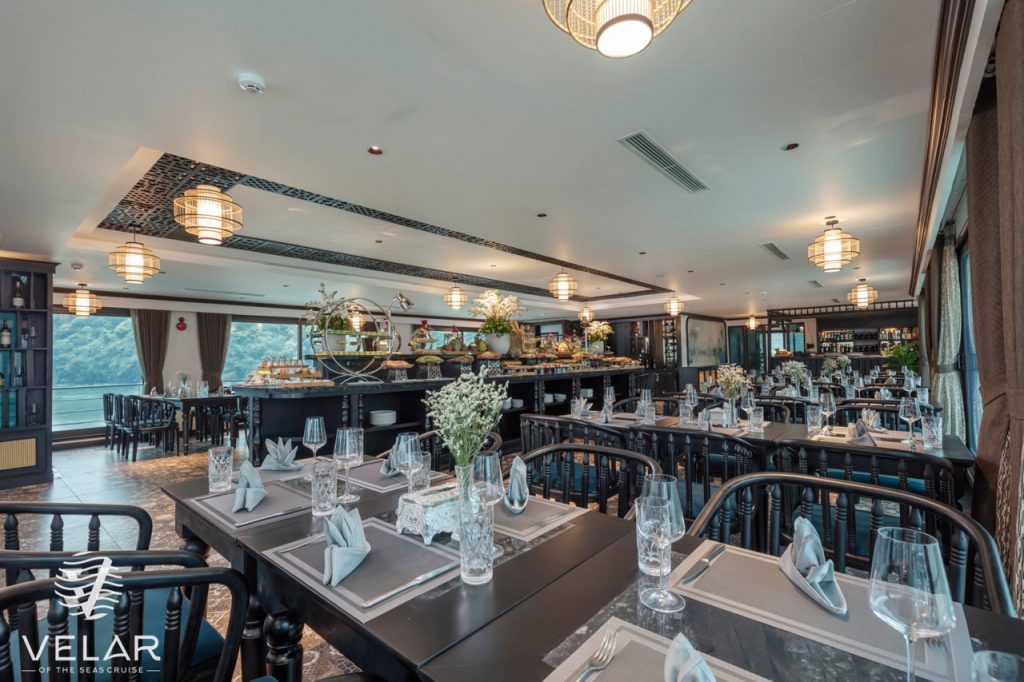 Luxurious cruise dining room with elegant decor and panoramic views, perfect for a memorable Halong.