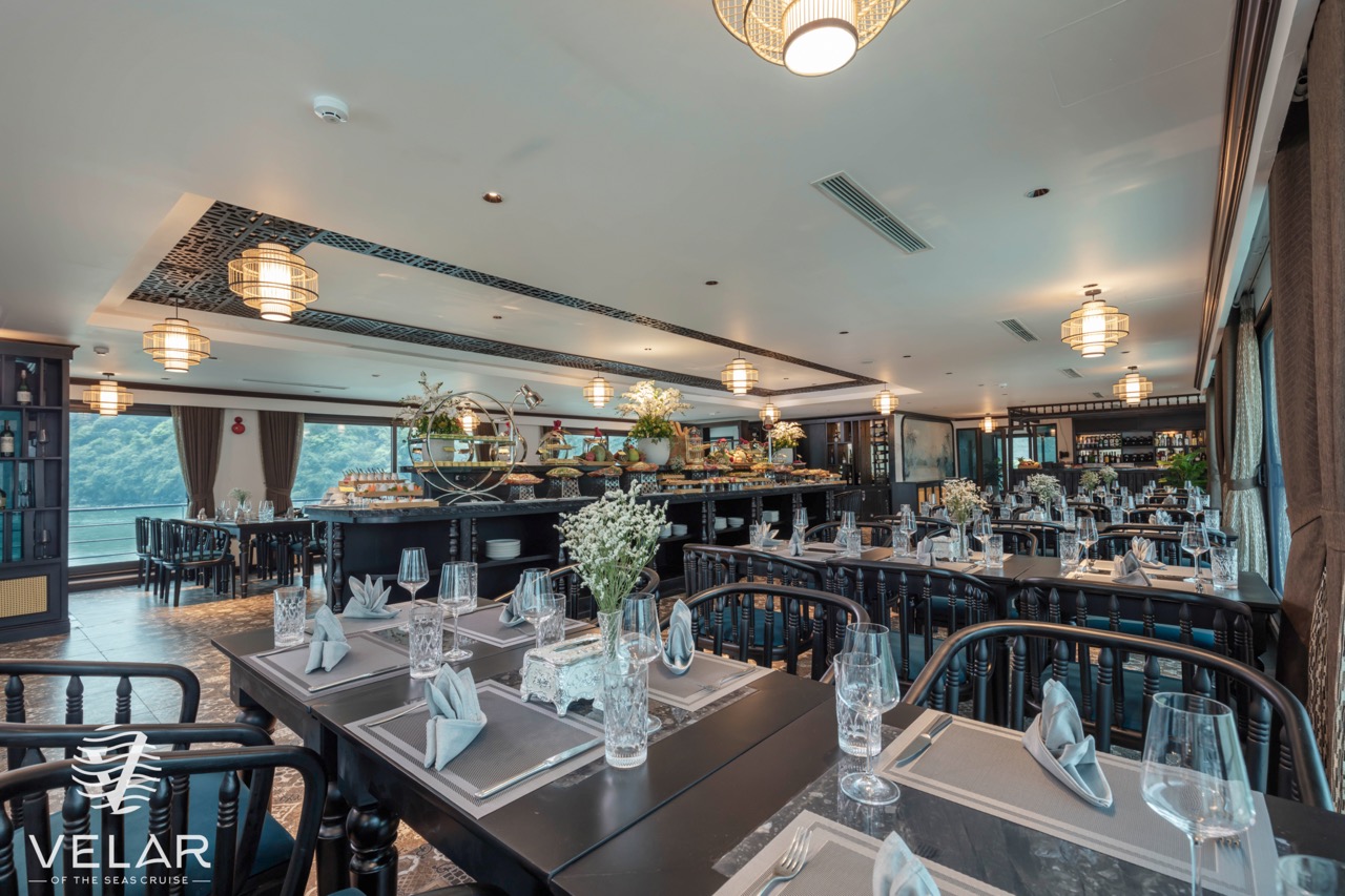 Luxurious cruise dining room with elegant decor and panoramic views, perfect for a memorable Halong.