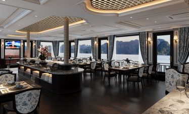 Luxurious cruise dining room with panoramic views of Lan Ha Bay, elegant decor, and comfortable seat.
