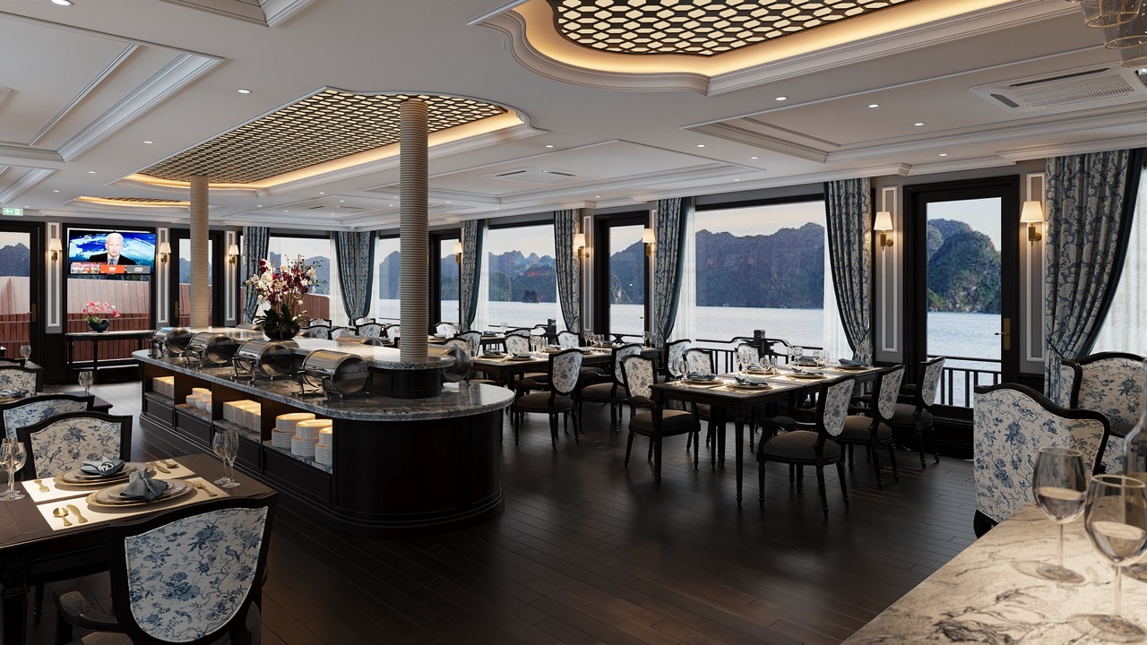 Luxurious cruise dining room with panoramic views of Lan Ha Bay, elegant decor, and comfortable seat.