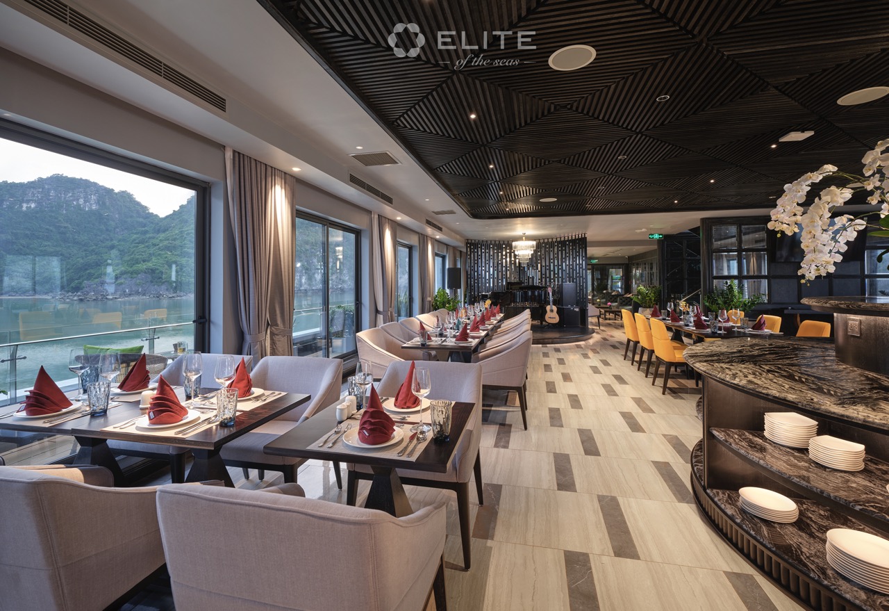 Luxurious Halong Bay cruise balcony with scenic views and elegant dining ambiance.