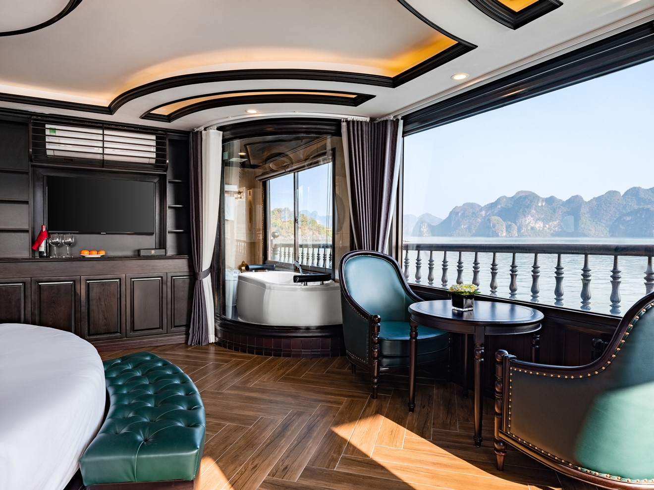 Stunning view from the cruise balcony overlooking Halong Bay's emerald waters and limestone karsts.