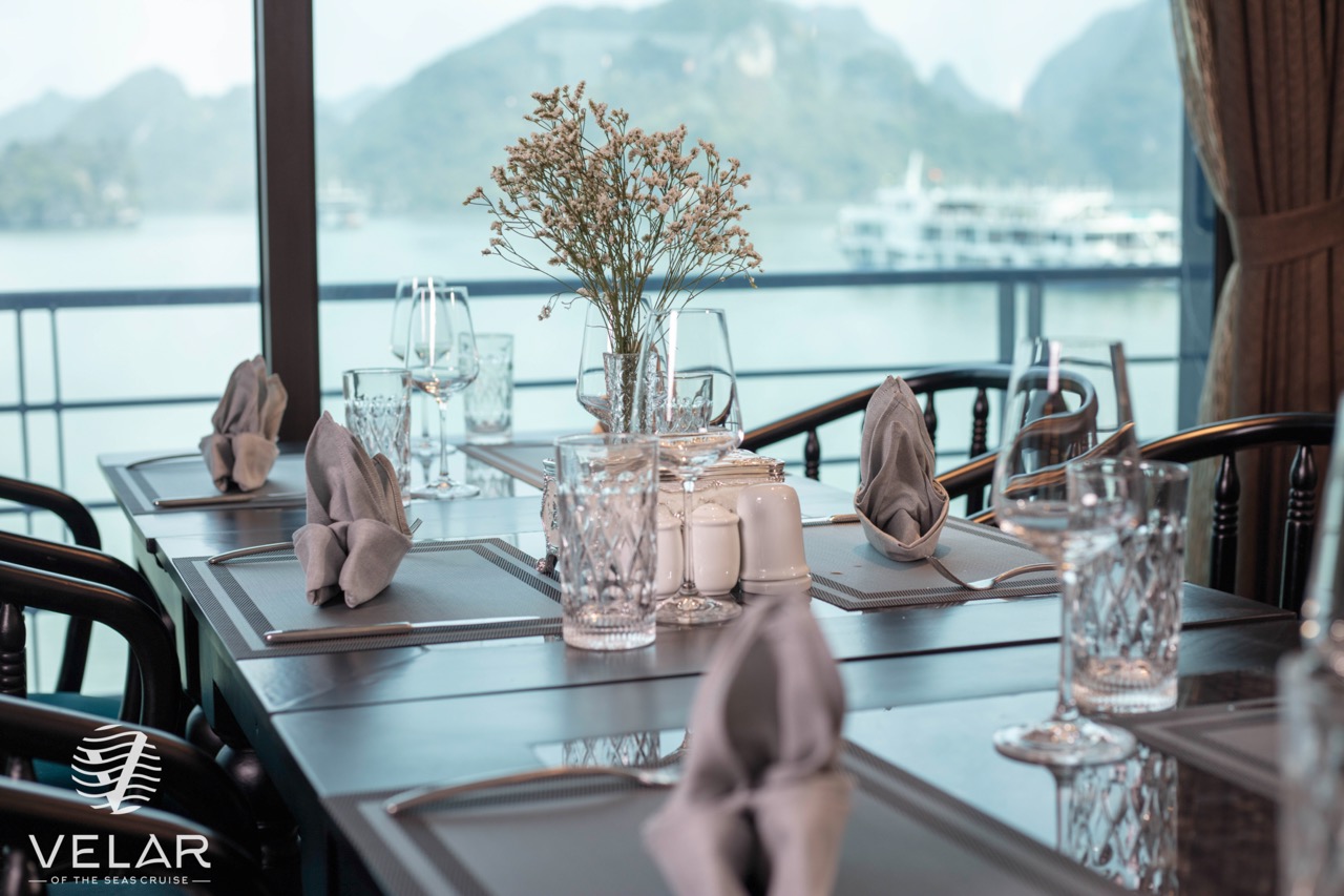 Luxurious cruise balcony with scenic Halong Bay views, perfect for relaxing and enjoying the sea bre.