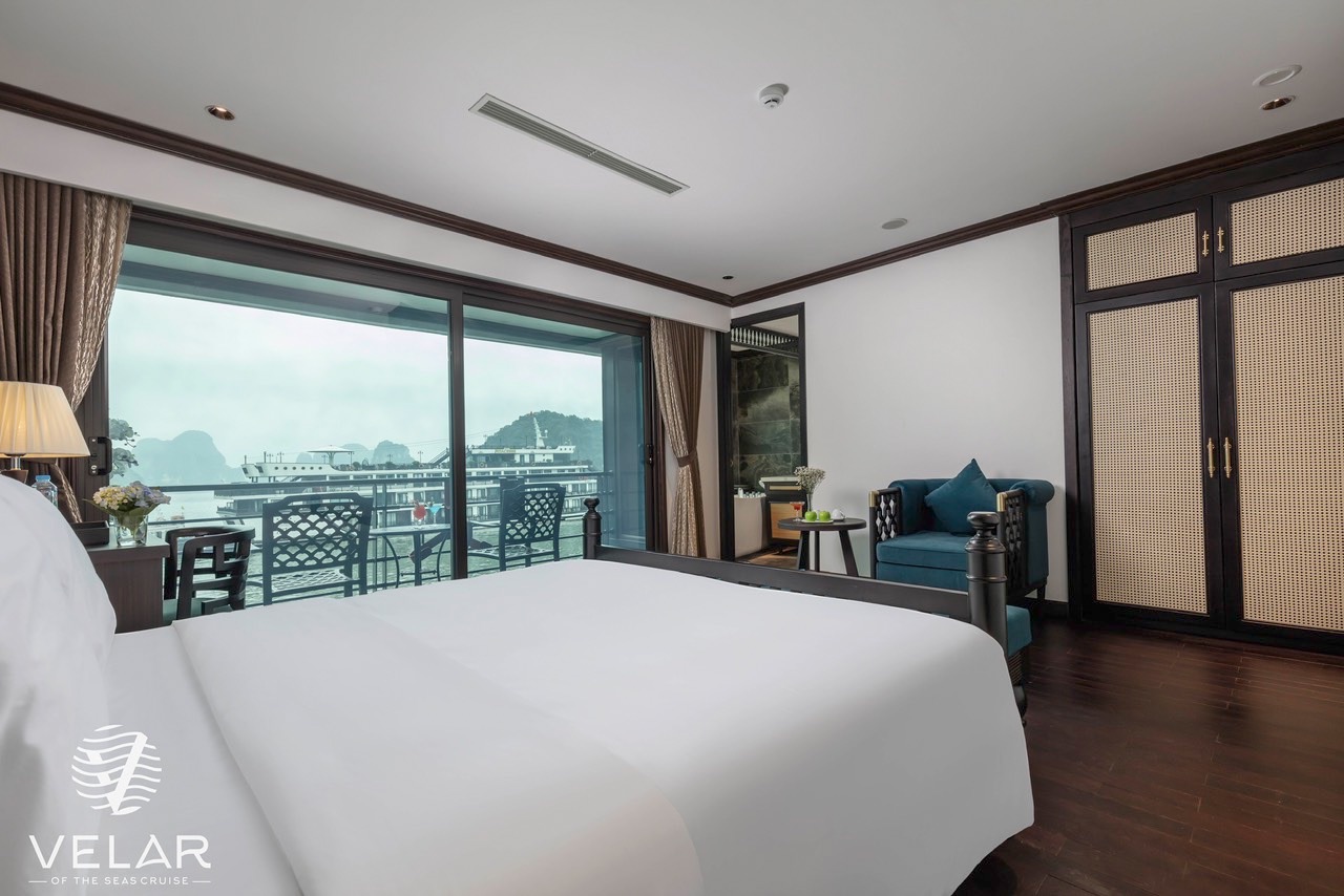 Halong Bay cruise balcony with stunning water views and elegant interior, perfect for a memorable Vi.