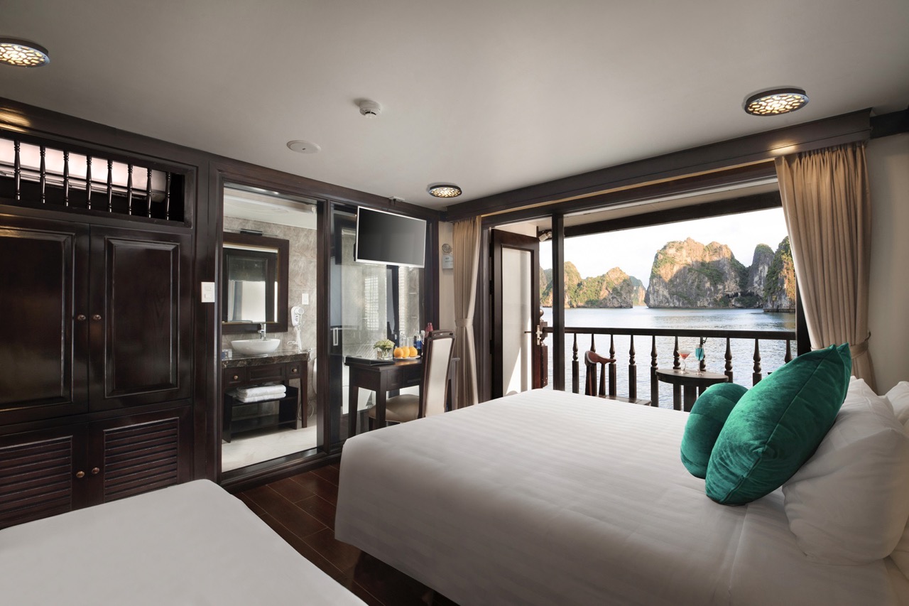Stunning view from a luxury cruise balcony in Halong Bay, perfect for relaxing and enjoying the scen.