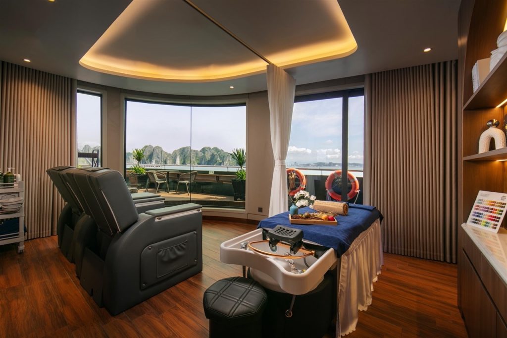 Stunning cruise balcony view of Halong Bay with modern amenities and panoramic windows.