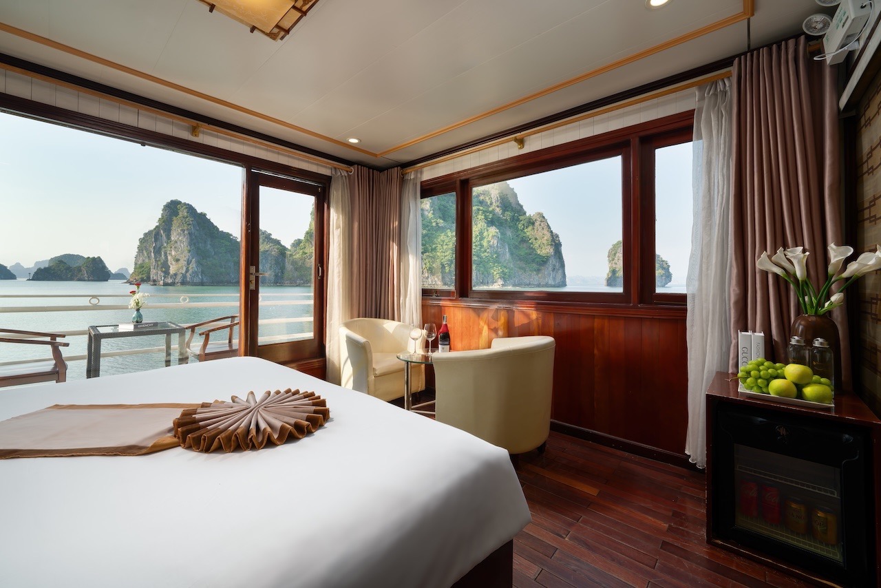 Stunning view from a luxury cruise balcony in Halong Bay, perfect for relaxing and sightseeing.