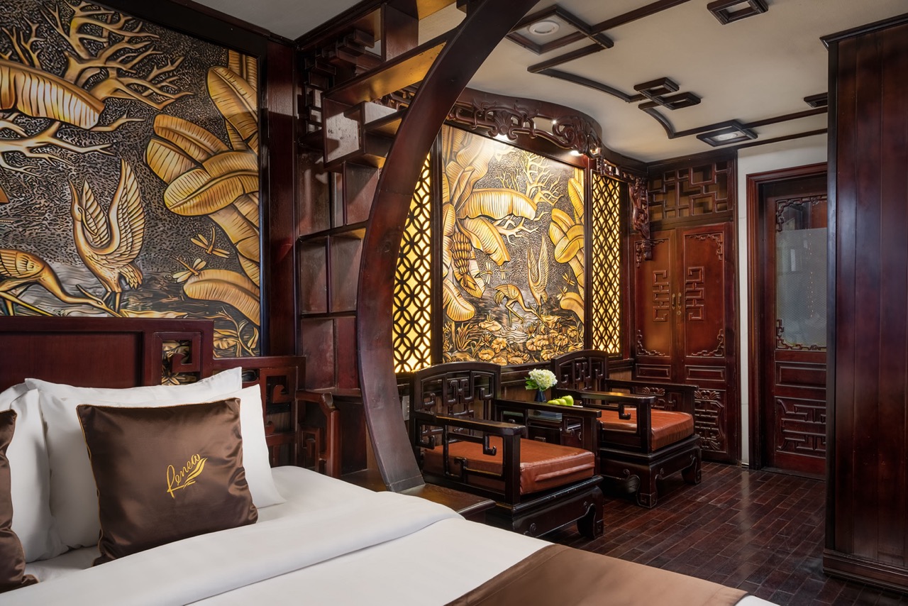 Luxurious cruise interior with traditional Asian decor and cozy ambiance in Bai Tu Long Bay.