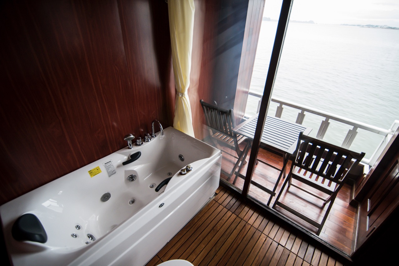 Scenic view from a cruise balcony overlooking Bai Tu Long Bay with relaxing ambiance and tranquil wa.