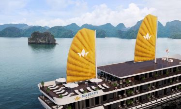 Luxury cruise balcony view of Lan Ha Bay with scenic limestone islands and calm waters.