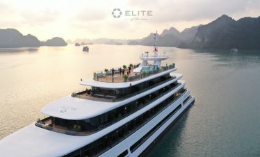 Elegant cruise ship on Halong Bay with scenic mountain views, perfect for a relaxing 2-day, 1-night.