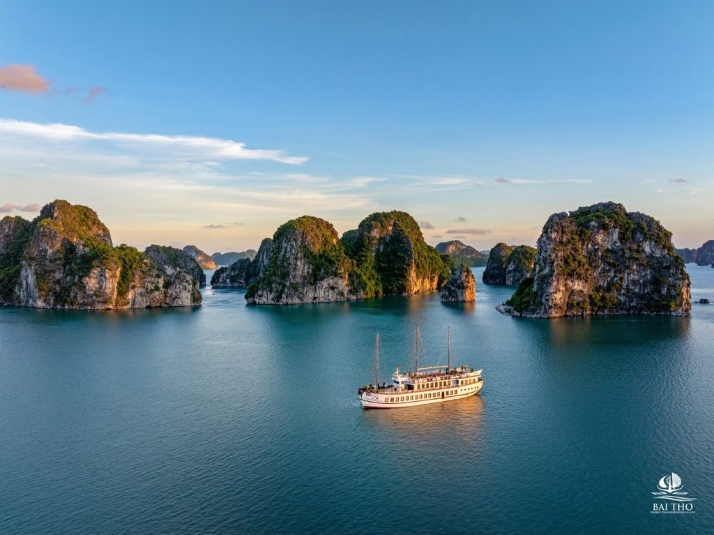 Bai Tu Long Bay cruise scene with limestone islands and calm waters, perfect for scenic exploration.