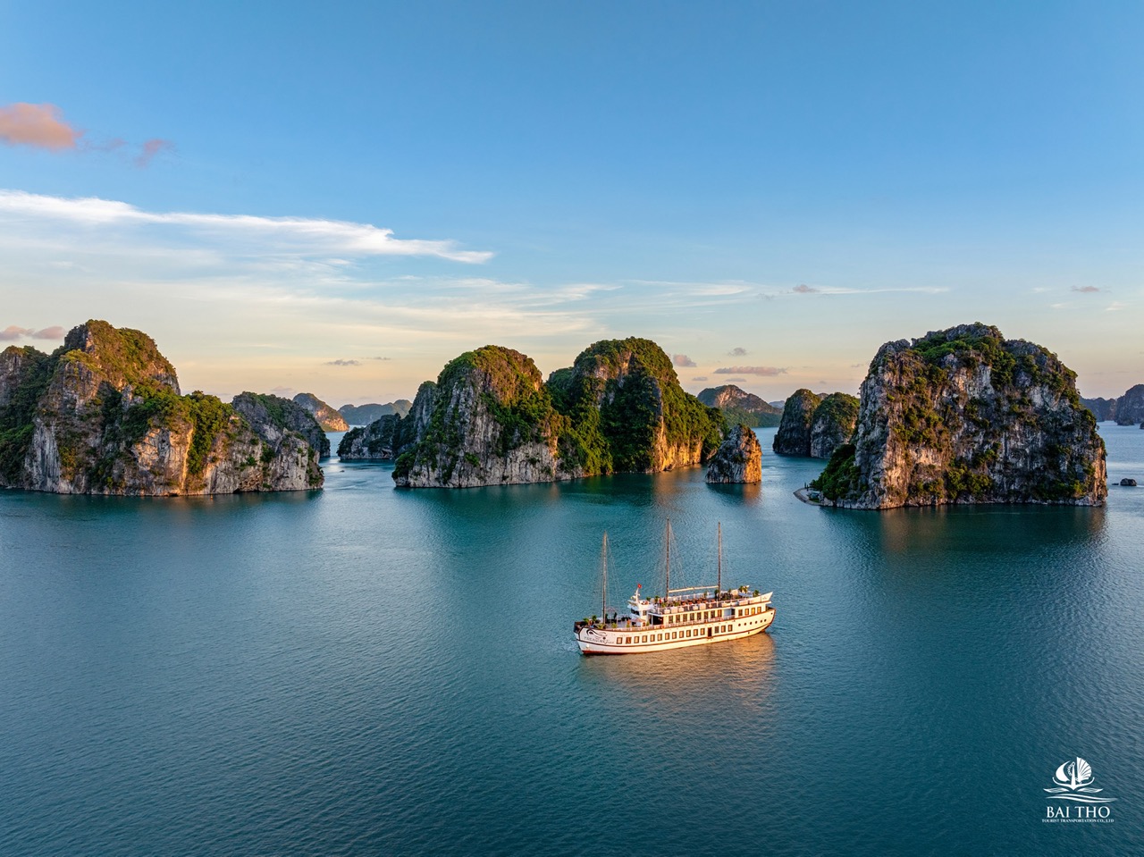 Bai Tu Long Bay cruise scene with limestone islands and calm waters, perfect for scenic exploration.
