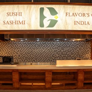 Fresh sushi and sashimi display at an Indian-themed restaurant in Vietnam, highlighting authentic flavors.