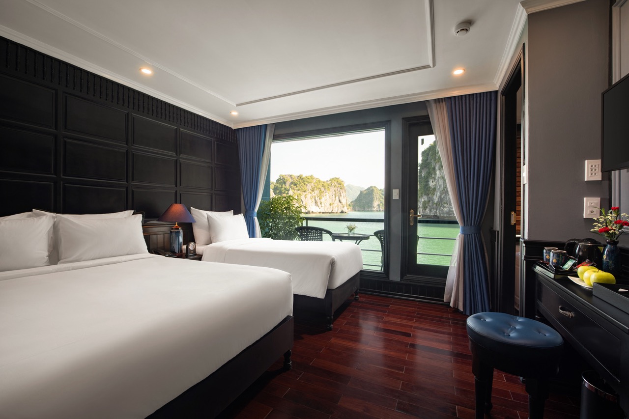 Stunning view from a luxury cruise balcony in Halong Bay, perfect for relaxing and sightseeing.