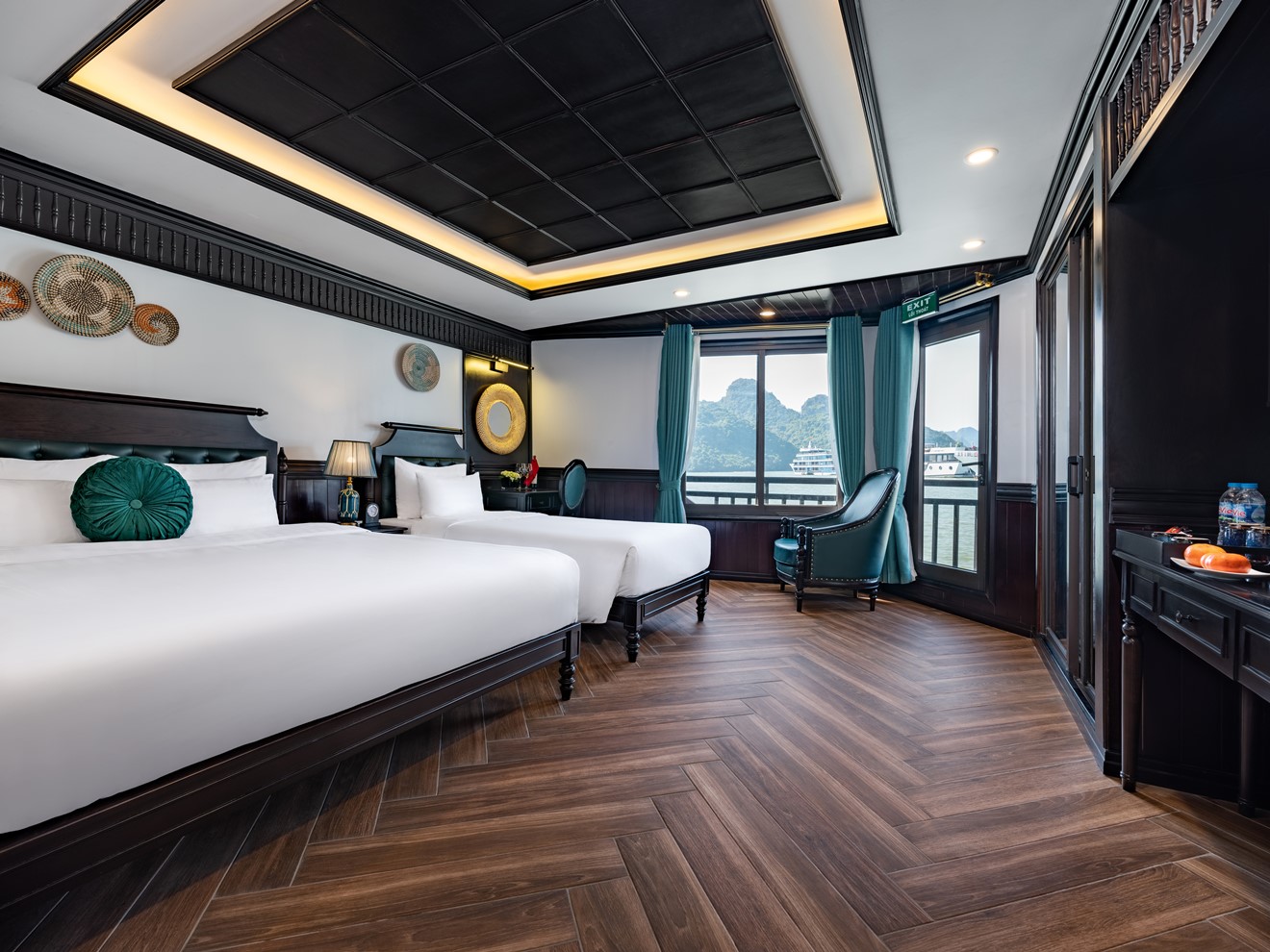 Luxury cruise cabin in Halong Bay featuring elegant decor and panoramic ocean views, perfect for a m.