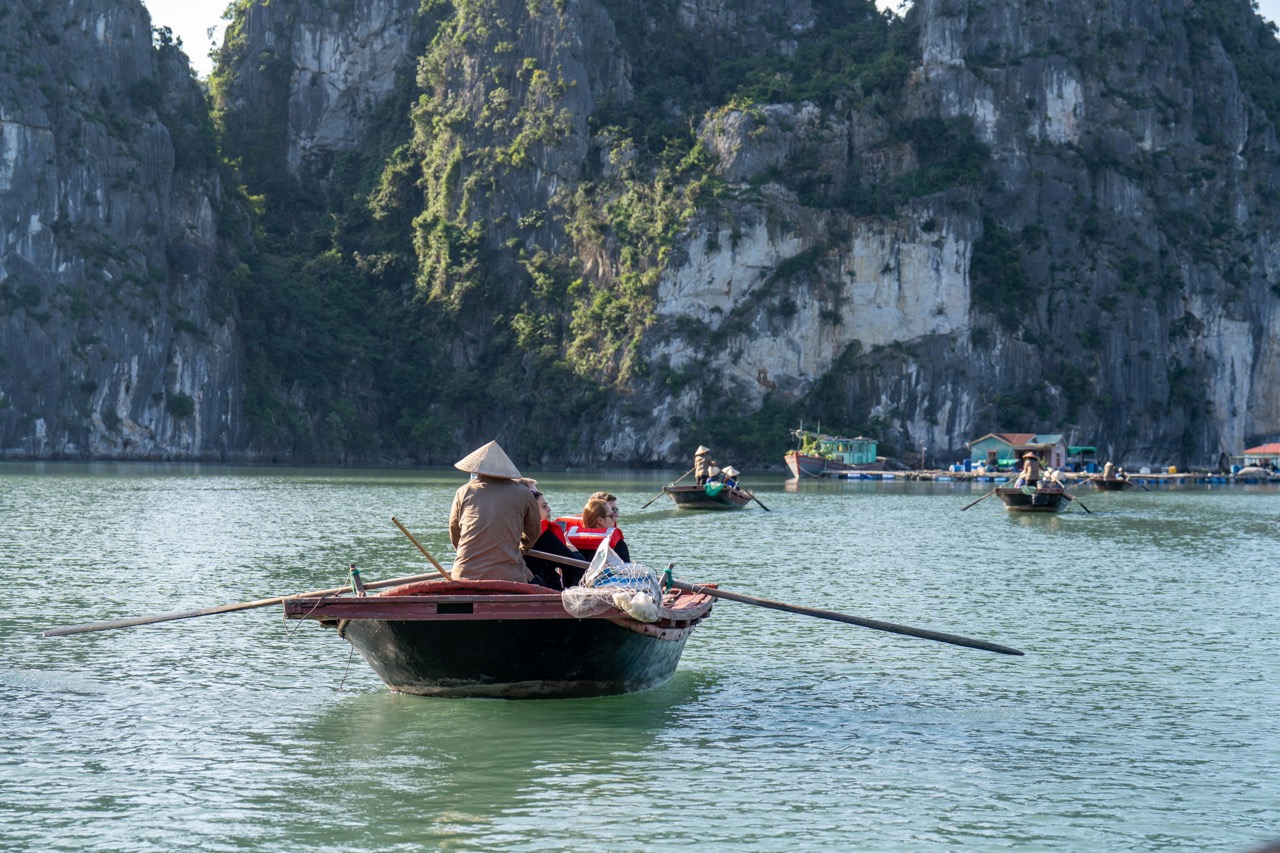 Kayaking scene on Halong Bay with scenic limestone karsts and tranquil waters, perfect for exploring.