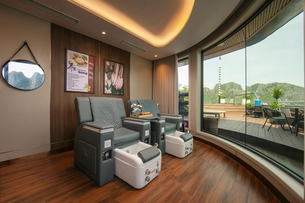 Relaxing spa room with massage chairs and balcony view, perfect for unwinding after exploring Halong.