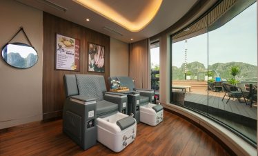 Relaxing spa room with massage chairs and balcony view, perfect for unwinding after exploring Halong.