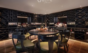 Luxurious cruise lounge with elegant decor and panoramic views of Halong Bay. Perfect for relaxing d.