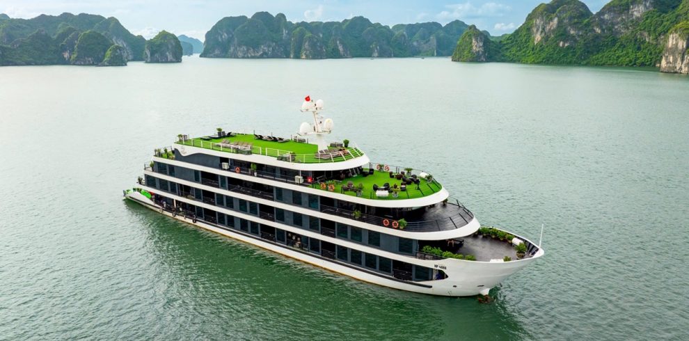 Lan Ha Bay Cruise 1 night - Luxurious cruise ship sailing through Lan Ha Bay with scenic limestone karsts.
