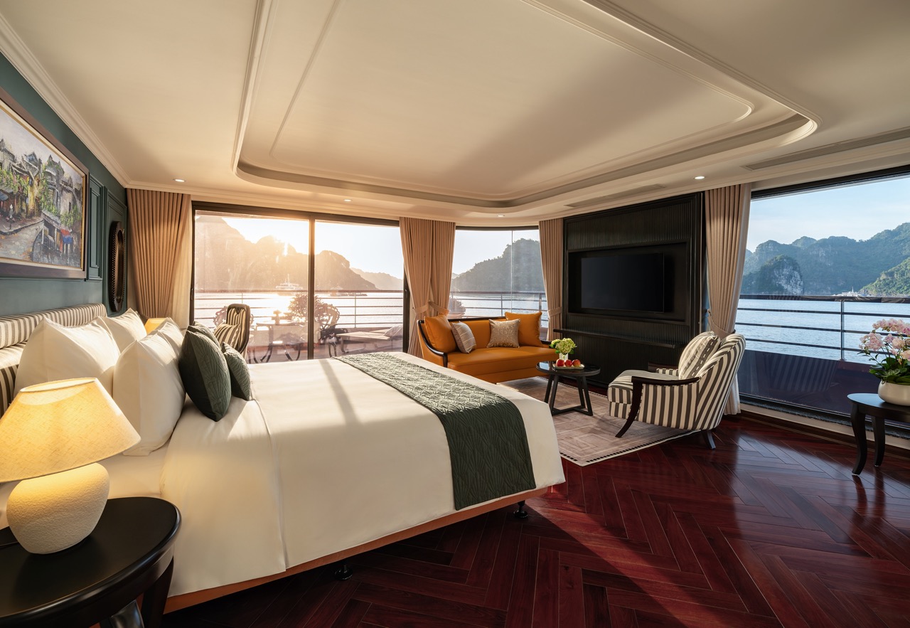 Elegant cruise balcony overlooking Lan Ha Bay with stunning sunset scenery and modern amenities.