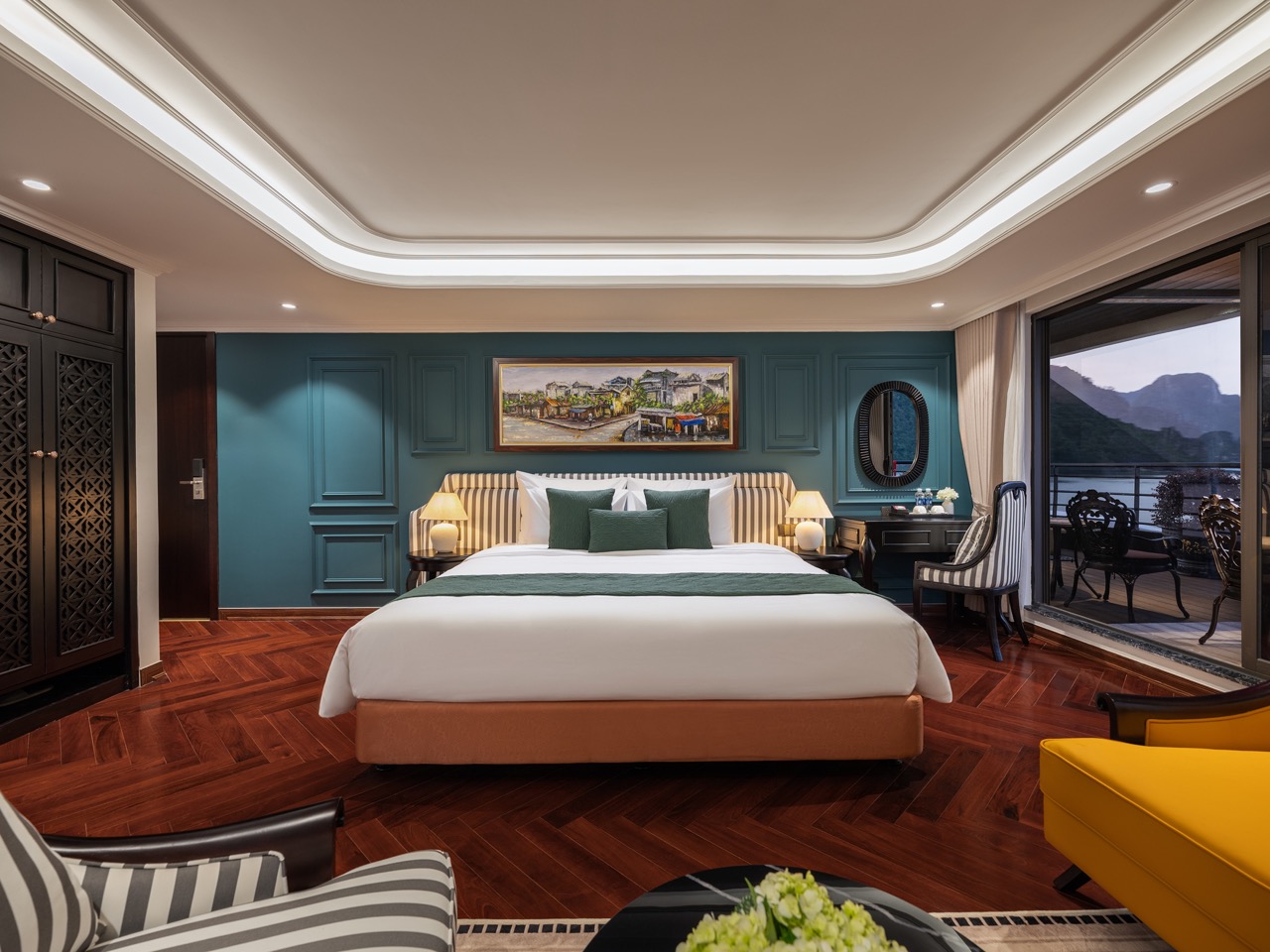 Lan Ha Bay cruise balcony with stunning mountain views and elegant interior design.