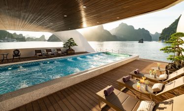 Relaxing scene of a cruise balcony with pool overlooking Lan Ha Bay, perfect for a tranquil travel e.
