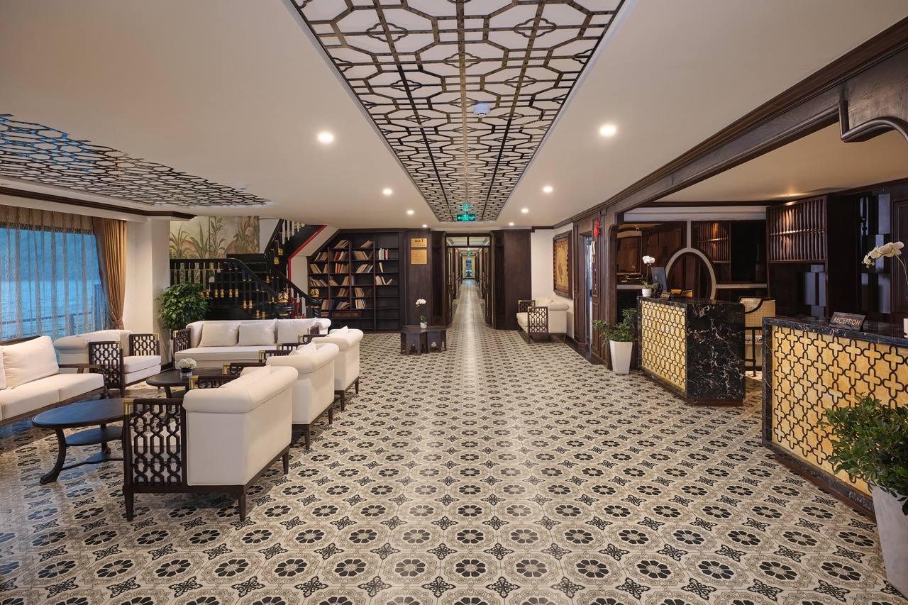 Spacious cruise lounge with elegant decor, comfortable seating, and ambient lighting, perfect for re.