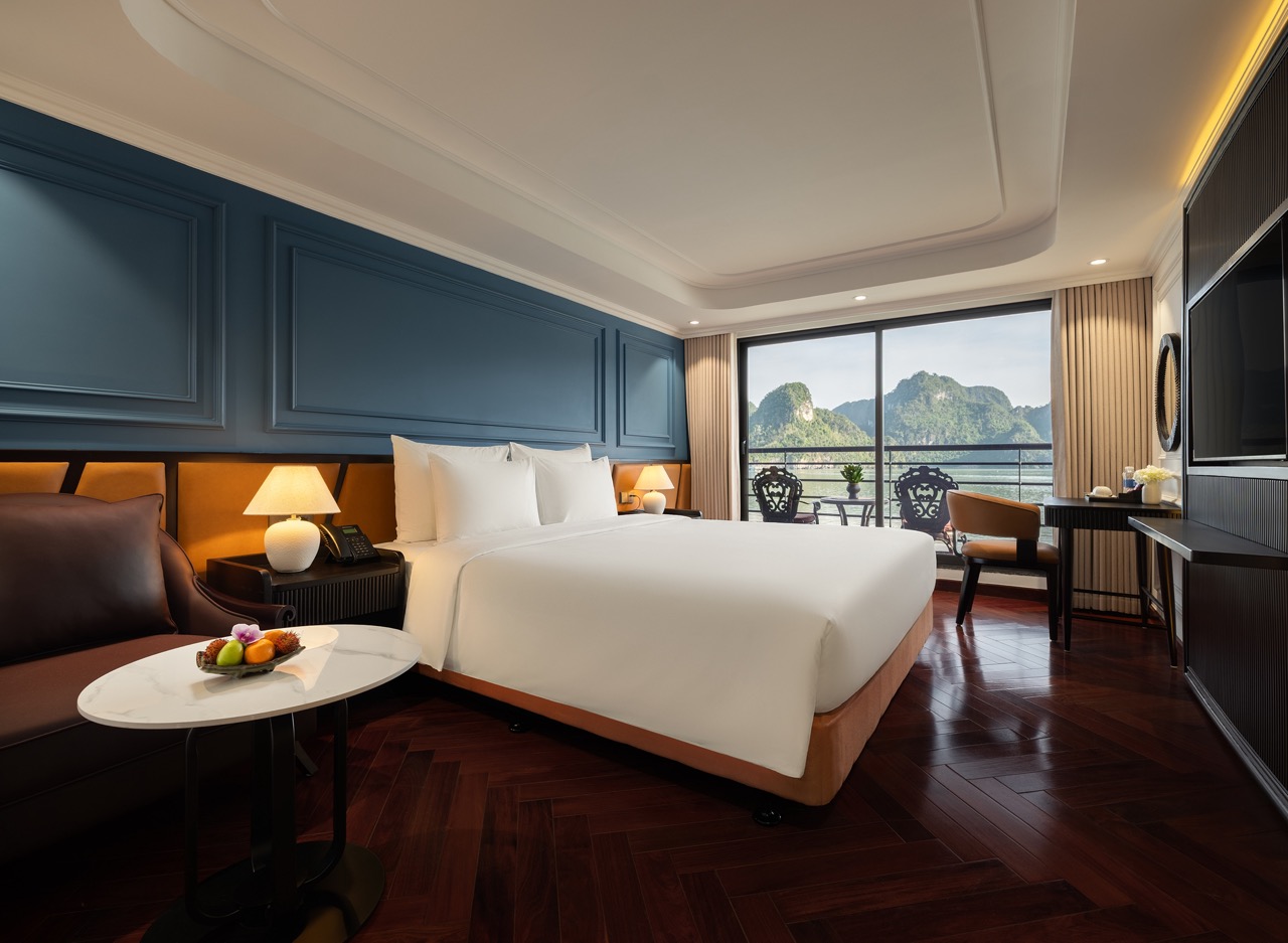 Stunning Lan Ha Bay cruise balcony scene showcasing elegant interior and breathtaking mountain scene.