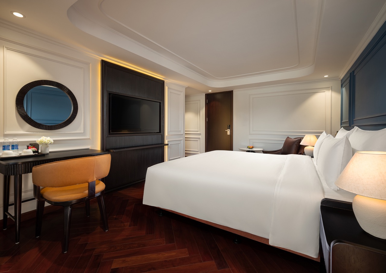 Elegant cruise cabin with modern decor and ocean views, perfect for a relaxing Lan Ha Bay getaway.
