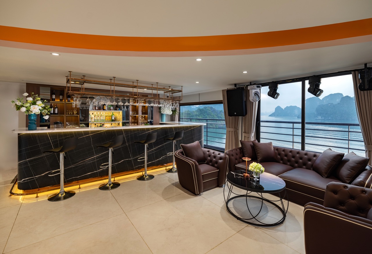 Elegant cruise lounge with panoramic views of Lan Ha Bay, perfect for relaxing and enjoying the scen.