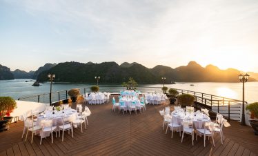 Stunning Lan Ha Bay cruise balcony with sunset, perfect for relaxing and enjoying scenic views.