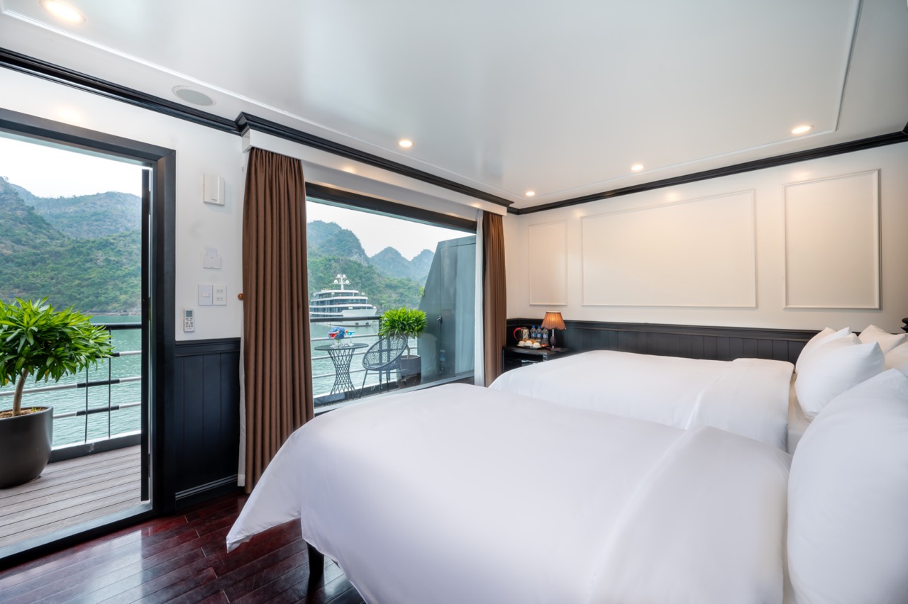 Elegant cruise balcony overlooking Lan Ha Bay with lush mountains and calm waters, perfect for relax.