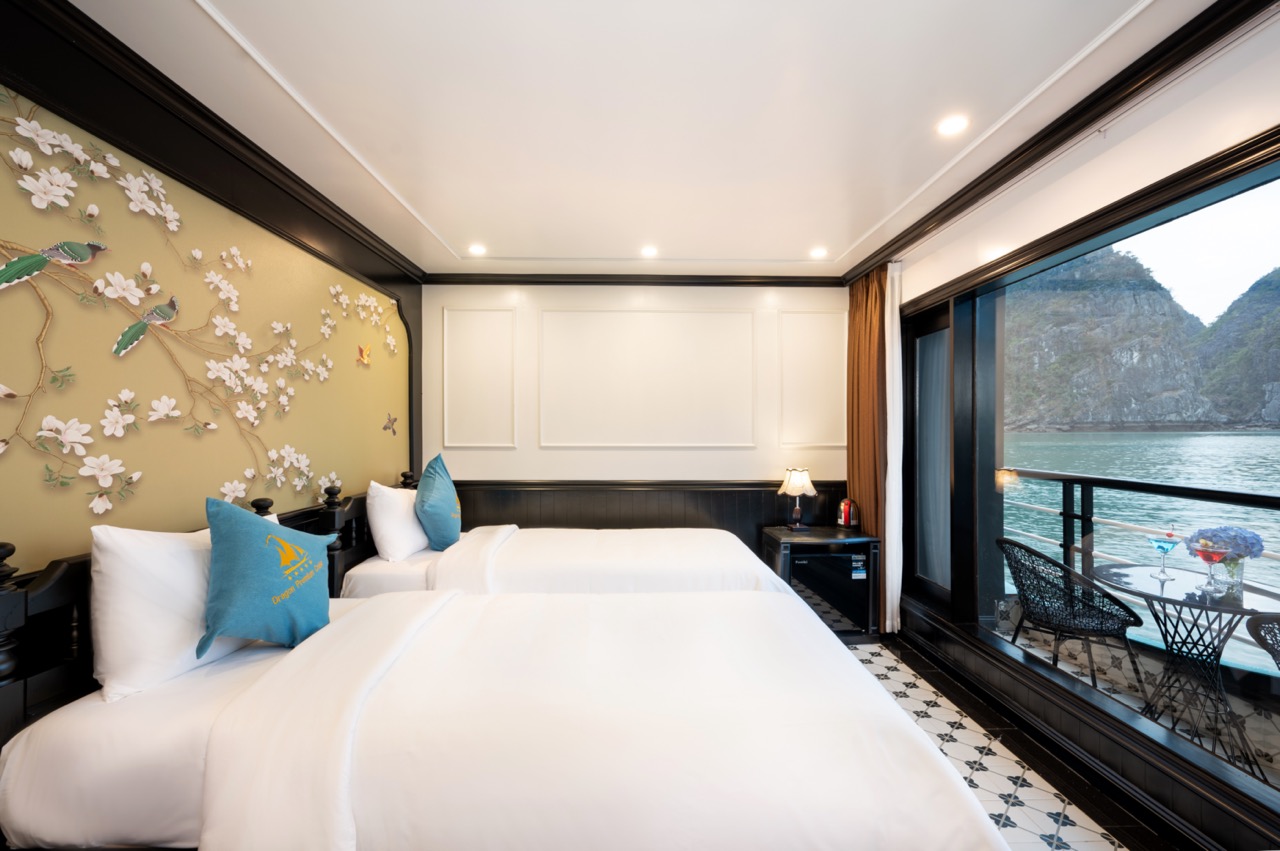Elegant cruise balcony room with scenic Lan Ha Bay views, perfect for relaxing and enjoying the tran.