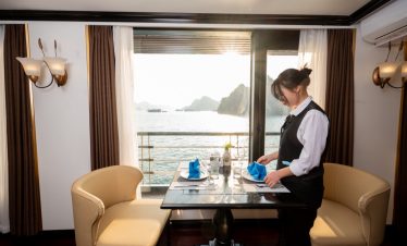 Elegant cruise balcony overlooking Lan Ha Bay with stunning seascape and tranquil atmosphere.