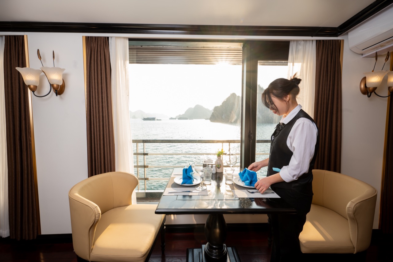 Elegant cruise balcony overlooking Lan Ha Bay with stunning seascape and tranquil atmosphere.