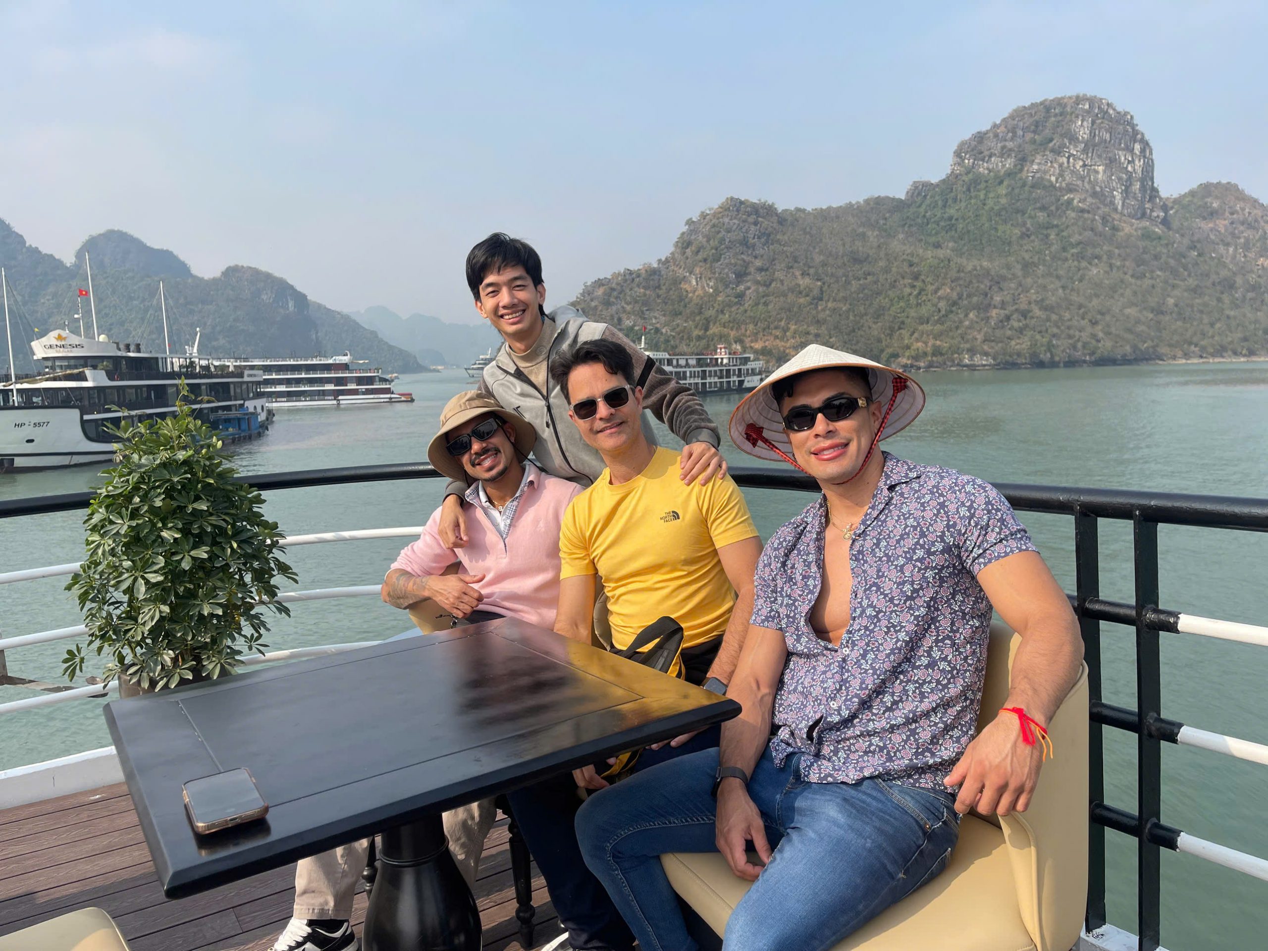 Enjoying Lan Ha Bay cruise balcony with stunning limestone karsts and calm waters, perfect for relax.